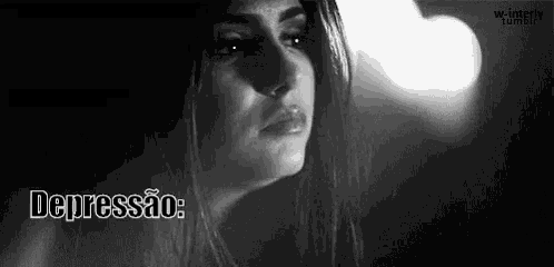 a woman is crying in a black and white photo with the words `` depressão '' written above her .