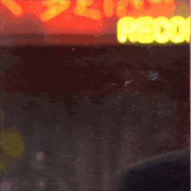 a close up of a man in a suit and tie