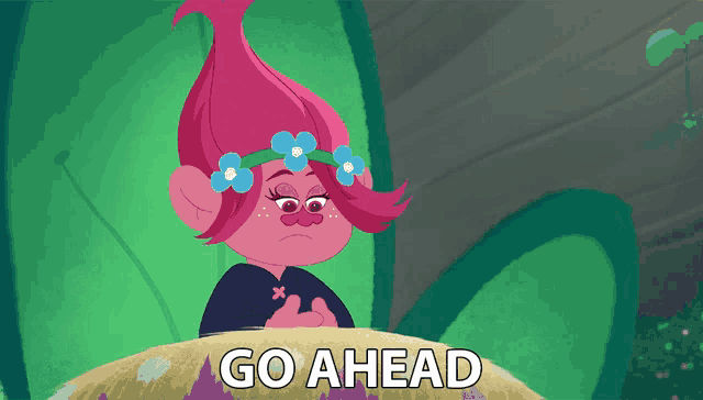 a troll with flowers in her hair and the words go ahead