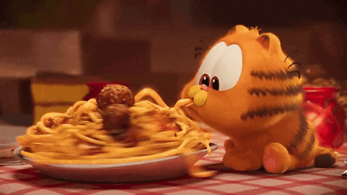 a cartoon cat eating spaghetti and meatballs on a table