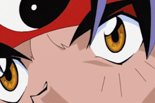 a close up of a person 's eyes with a red hat