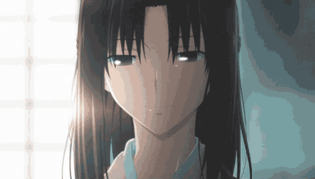 a close up of a girl 's face with tears running down her face