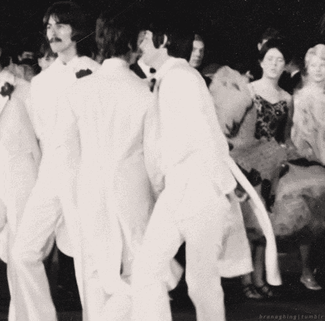 a group of people are dancing in a black and white photo taken by branesblog tumblr