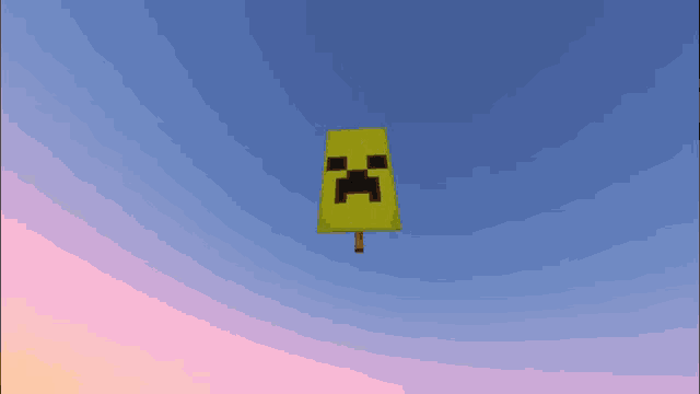 a yellow sign with a creeper face on it is flying in the sky