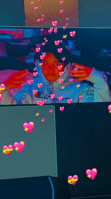 a picture of a person with pink hearts around their head
