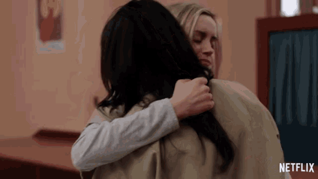 a netflix ad shows two women hugging