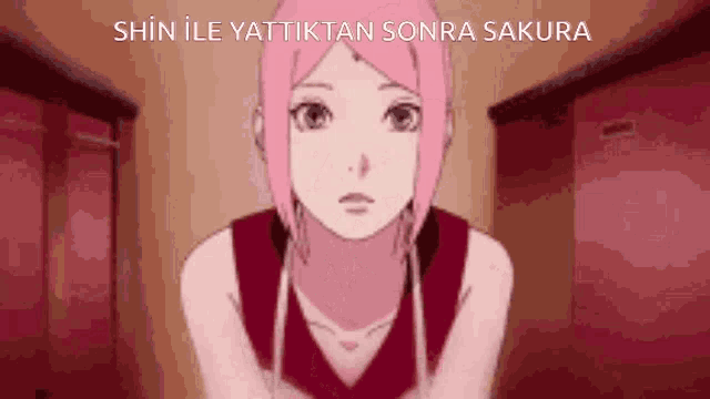 a girl with pink hair is standing in a hallway with the words shin ile yattiktan sonra sakura on the bottom