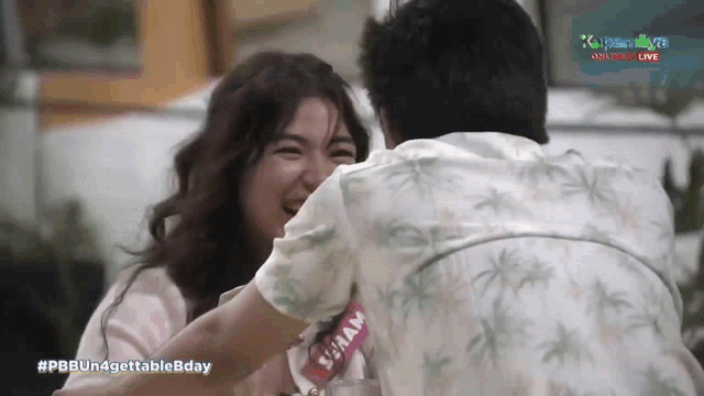 a man and a woman are hugging with the hashtag pbbun4gettablebday