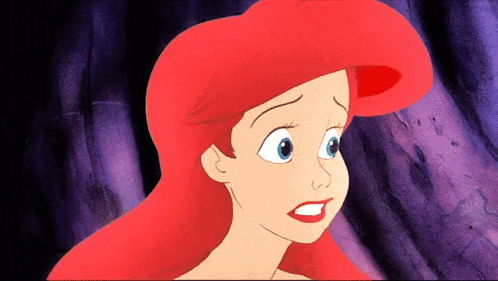 a close up of a cartoon girl with red hair and blue eyes