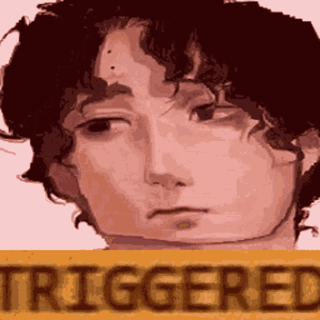 a close up of a person 's face with the word triggered on it