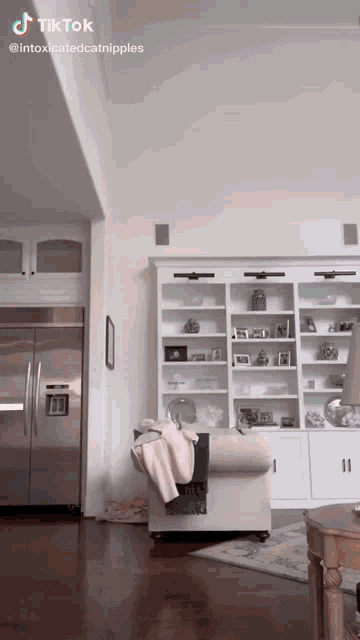 a living room with a couch and a refrigerator and the words tiktok on the corner