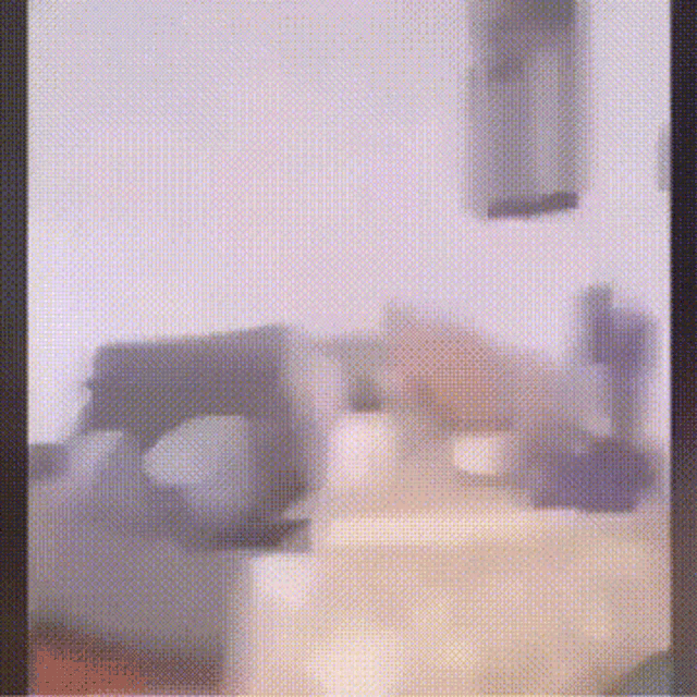 a blurred image of a room with a couch and a table