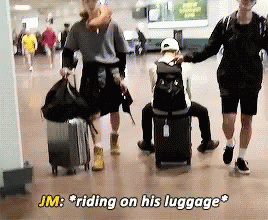 Jimin Bts GIF - Jimin Bts Ridding On His Luggage GIFs