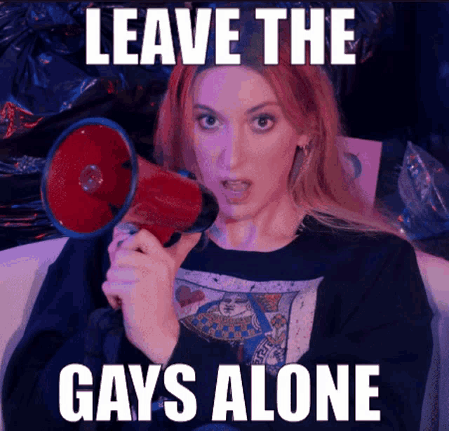 a woman holding a megaphone with the words " leave the gays alone " on it