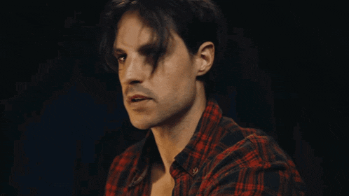 a man in a plaid shirt is saying " i don 't know what i 'm doing "