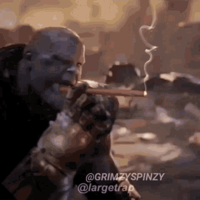 a man is smoking a cigar with the hashtag grimzyspinzy at the bottom