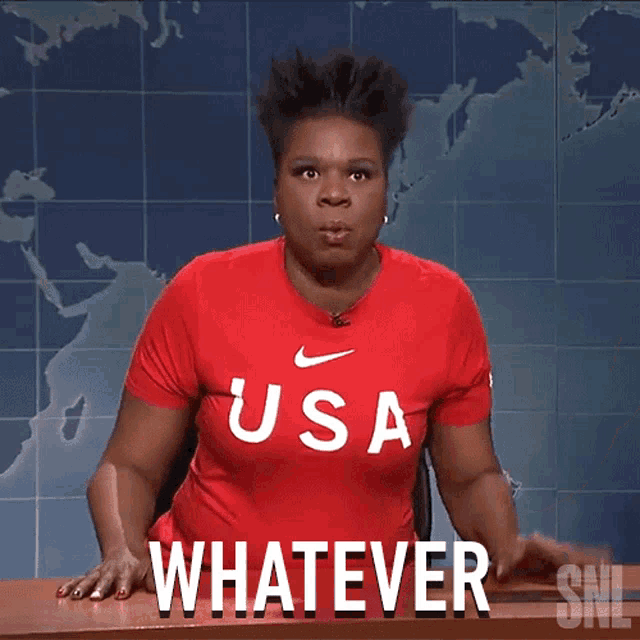 a woman wearing a red shirt that says usa says whatever