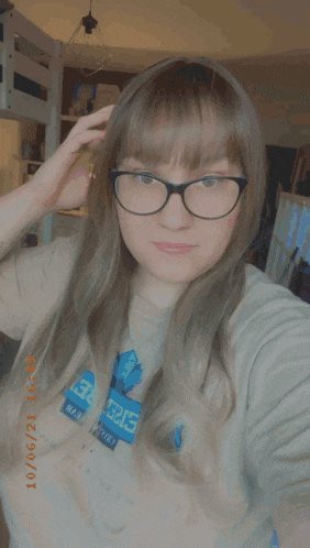 a close up of a woman 's face with glasses and a date of 10/06/2021