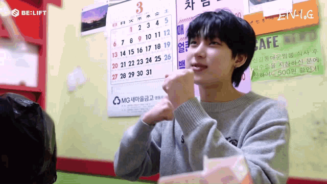 a person sitting in front of a calendar with the date of 3