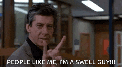 a man in a suit is giving the middle finger and says people like me i 'm a swell guy !!!