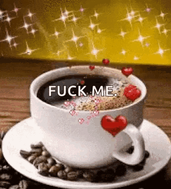 a cup of coffee with hearts and the words " fuck me "