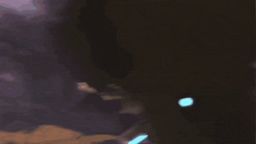 a person wearing a gas mask with a purple light shining through it