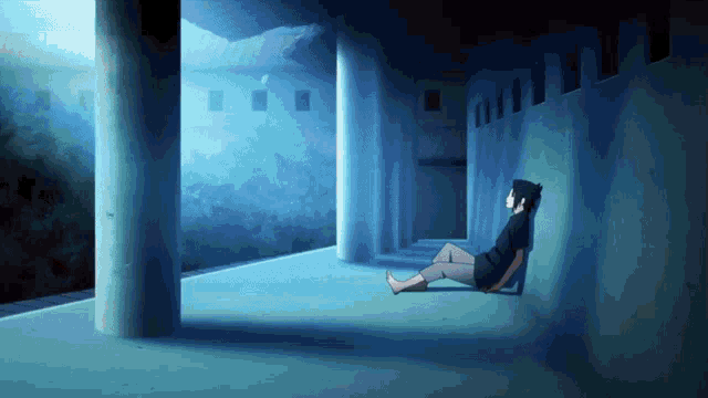 a person leaning against a pillar in a dark room