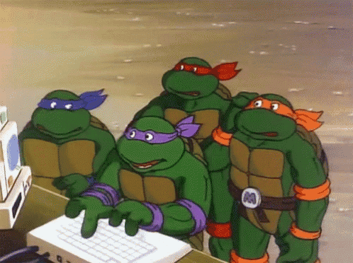 a group of teenage mutant ninja turtles are standing around a computer