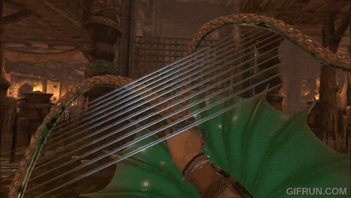 a person is playing a harp with a gifrun.com watermark