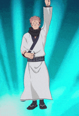 a man in a white robe is standing with his fist up in the air