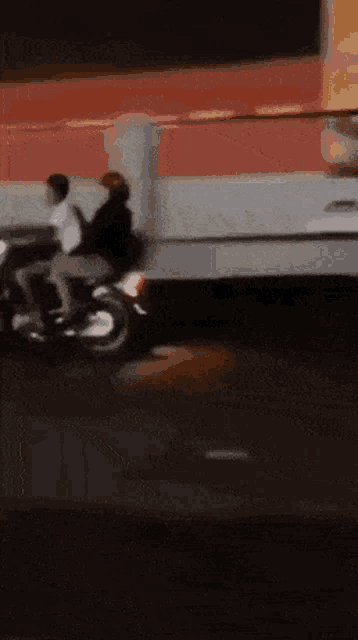 a person is riding a motorcycle down a street