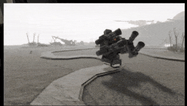 a black and white photo of a robot with a lot of guns on it