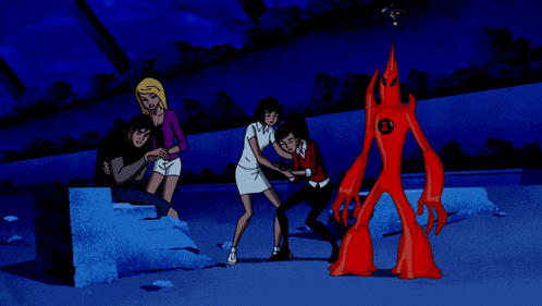 a group of cartoon characters are standing around a red monster with an a on it