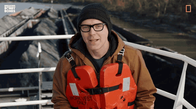 a man is wearing a life vest that says northwest only