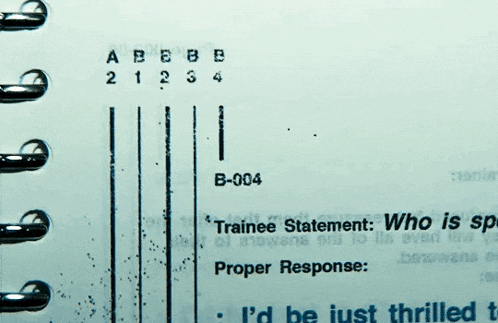 a spiral bound notebook has a trainee statement on it