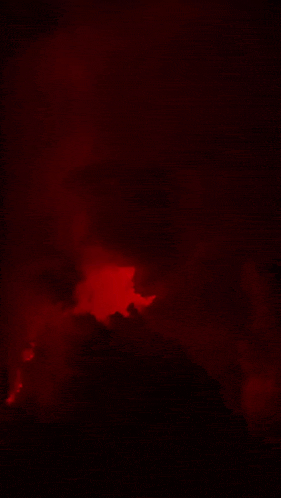 a painting of a red lightning bolt with a skull in the background