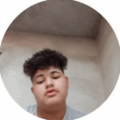 a young man with curly hair is in a circle looking at the camera