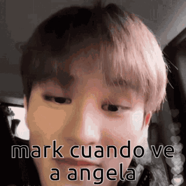 a close up of a person 's face with the words mark cuando ve a angela