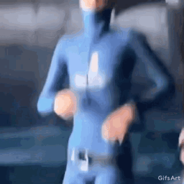a cartoon character is wearing a blue suit and dancing .