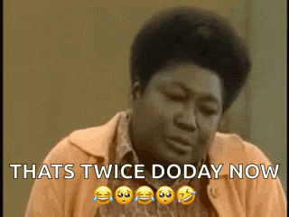 a man in an orange sweater is laughing and saying `` that 's twice doday now '' with emojis .