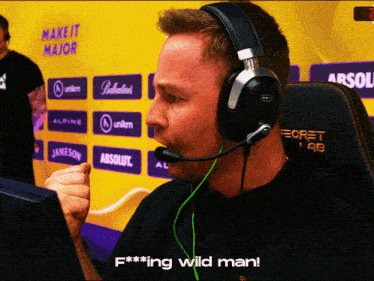 a man wearing headphones and a secret lab chair