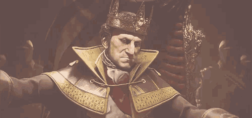 a man with a crown on his head is sitting in a chair