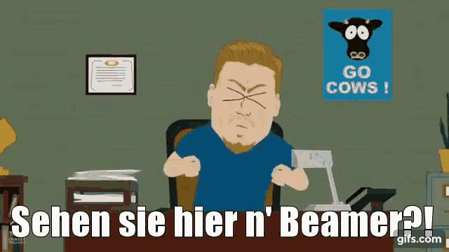 a cartoon of a man sitting at a desk holding a poster that says go cows