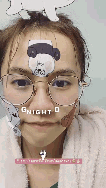 a woman wearing glasses and a mask that says gnight d on her face