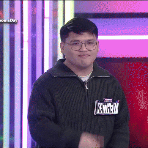 a man with a name tag that says matthew on it