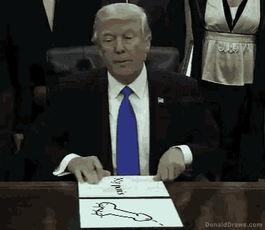 donald trump is sitting at a table with a drawing of a penis on it