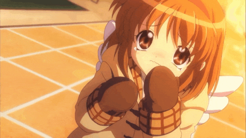 a little girl with orange hair and brown gloves looks sad