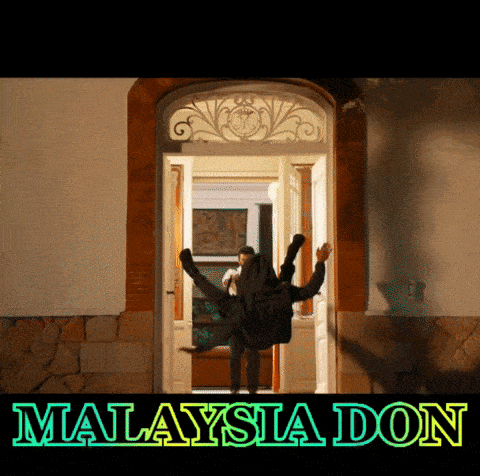 a man is upside down in a doorway with the words malaysia don written below him
