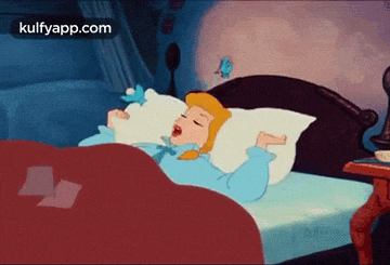 a cartoon of cinderella sleeping in a bed with a bird flying around her .
