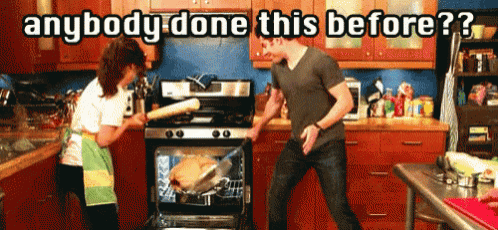 a man and a woman are dancing in a kitchen with the words anybody done this before written above them